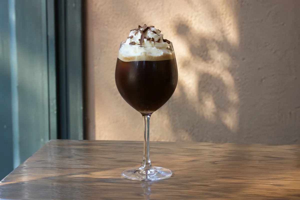 Image of Anatole Coffee in a Red Wine Glass